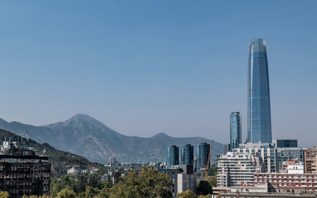 a view of a city with mountains in the background
