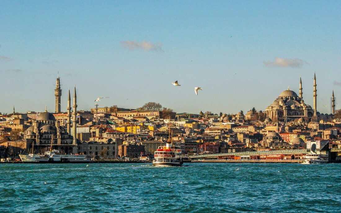 city buildings near body of water during daytime