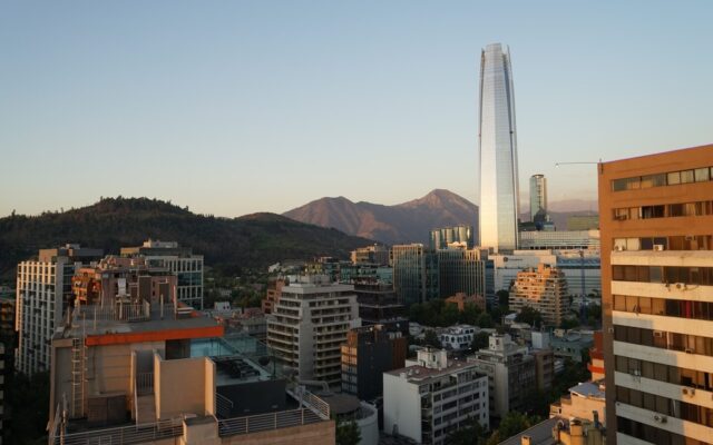 a view of a city with mountains in the background