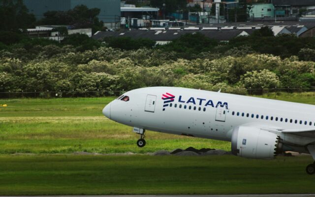 a large passenger jet taking off from an airport runway